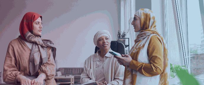 hijabi women discussing work